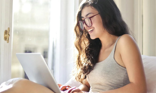 Woman searching on laptop